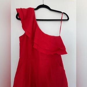 Red one shoulder ruffle romper